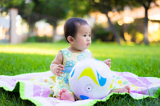 istock little baby playing in the park 469846952