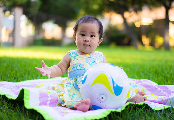 istock little baby playing in the park 469846954