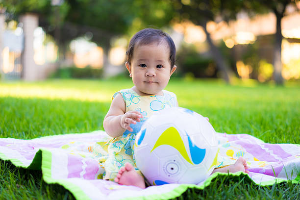 istock little baby playing in the park 469846956
