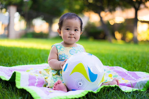 istock little baby playing in the park 469846964