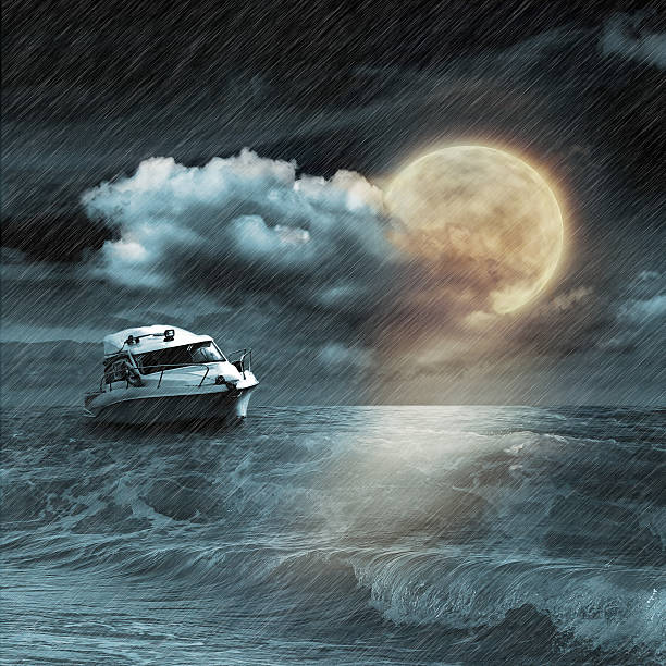istock Boat in storm  evening on ocean and the moon 469850265