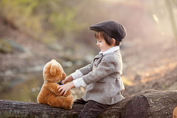 istock Adorable little boy with his teddy bear friend 469855102