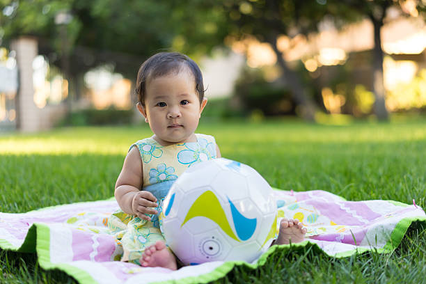 istock little baby playing in the park 469857948