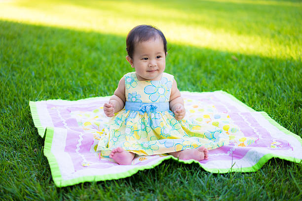 istock little baby playing in the park 469857978