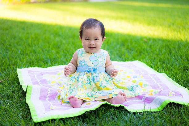 istock little baby playing in the park 469858706