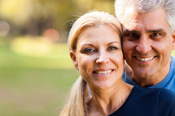 istock middle aged couple closeup portrait 469859937