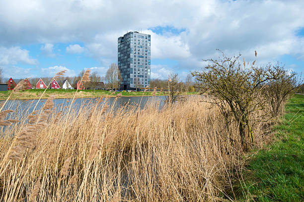 istock Highrise along he shore of a canal in spring 469861456