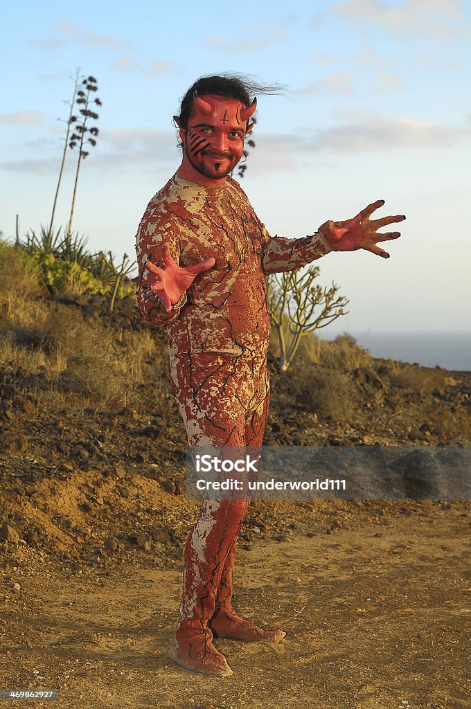 The Devil Latin American Man with Long Hairs Masked as a Devil in the Desert Adult Stock Photo