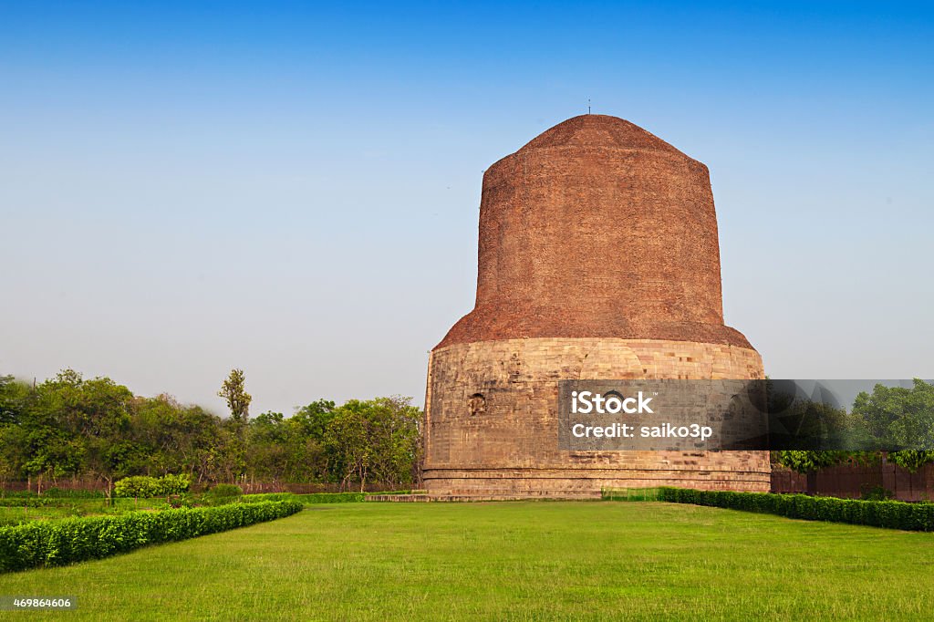 Dhamekh Stupa Dhamekh Stupa on green grass in Sarnath, IndiaDhamekh Stupa and ruins in Sarnath, India 2015 Stock Photo