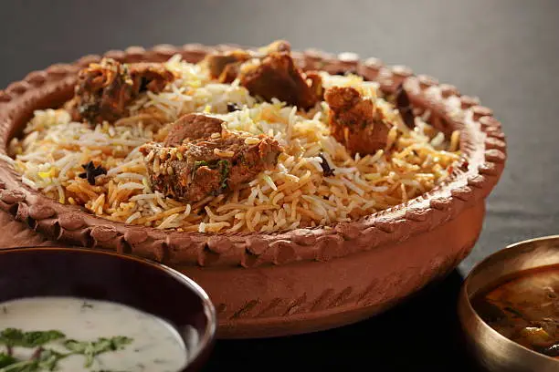 Mutton Gosht Biryani - Lamb, hogget, and mutton are the meat of domestic sheep or Goat. Biryani, biriani, or beriani is a set of primarily South Asian rice-based foods made with spices,rice (usually basmati) and meat/vegetables. Mutton gosht biryani contains Mutton as a major ingredient.