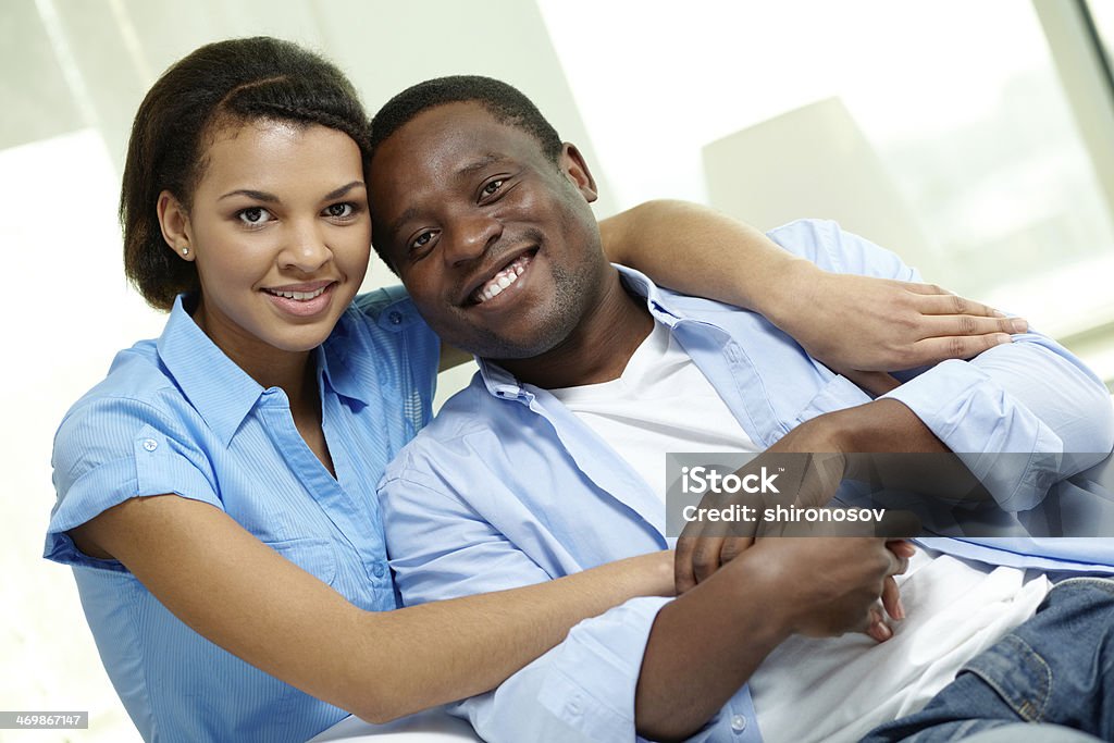 Amorous couple Image of young African couple looking at camera Adult Stock Photo