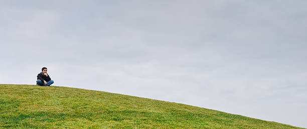 istock Young boy on a dune-Horizon over green grass 469867918