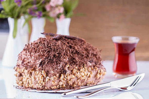 istock Whole Round Cake and Slice on Wood Table 469868148