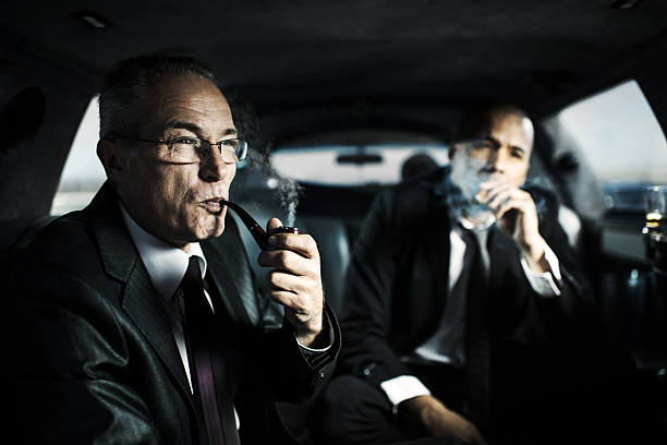 istock Business people in a limousine. 469868289