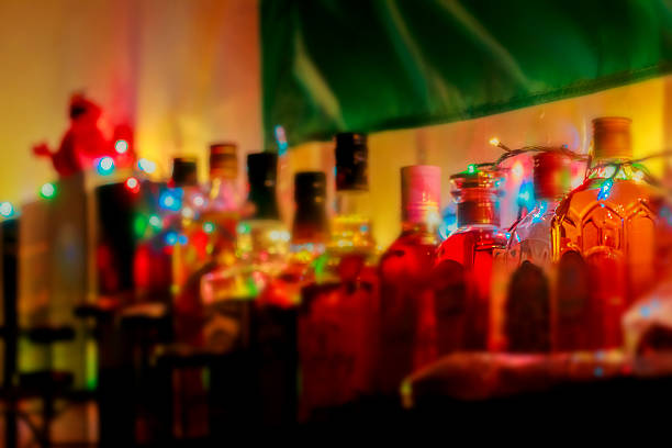 istock Shelf with alcohol bottles lighted garland 469868320