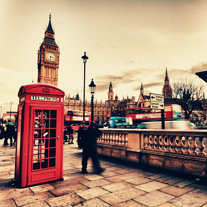 Traditional telephone box  and Big Ben at the background.Simulation of film 400iso.