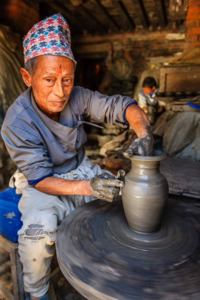 istock Nepali potter working on the pottery square in Bhaktapur 469868399