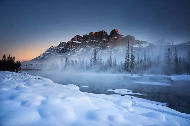A cold winter day on the Bow River with Castle Mountain in the background.  Banff National Park, Alberta Canada.