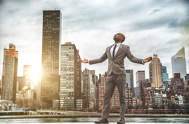 istock Successful business man looking away against the skyline 469868433