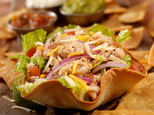 Chicken Taco Salad Grilled Chicken Taco Salad with Lettuce, Tomatoes, Red Onions and Cheese - Photographed on Hasselblad H3D2-39mb Camera Taco Salad stock pictures, royalty-free photos & images