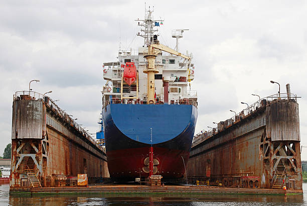 istock Floating dry dock with blue industrial tanker ship 469868706