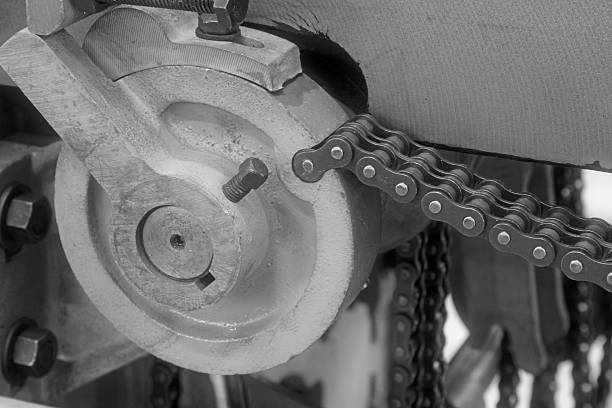 istock Mechanical equipment iron wheel chains in a factory, closeup of 469868932