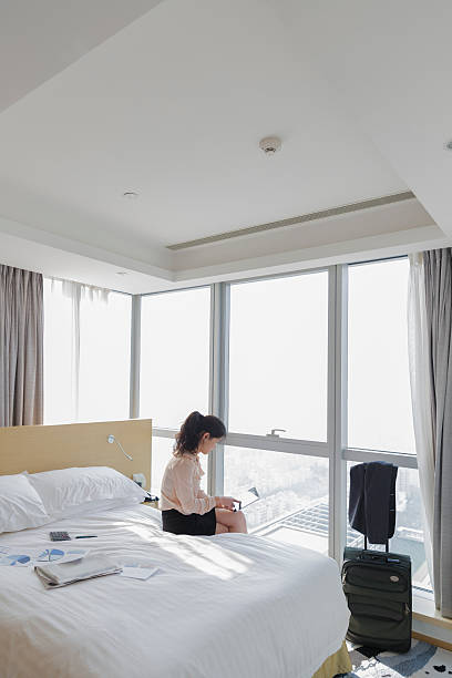 istock young woman at hotel 469868997