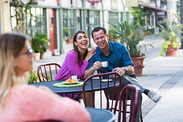 istock Hispanic couple at sidewalk cafe 469869093