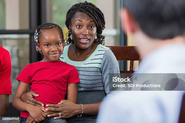 Mother And Daughter Talking With Counselor During Family Counseling Session Stock Photo - Download Image Now