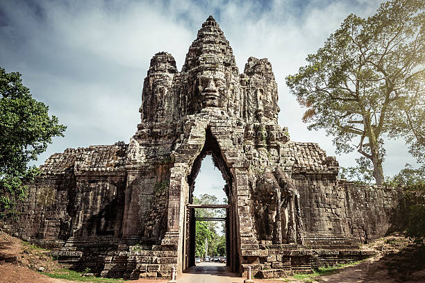 Angkor Thom Gate Cambodia Impressive Stone Entrance Gate of Angkor Thom. Angkor Wat, Cambodia, South East Asia. khmer stock pictures, royalty-free photos & images