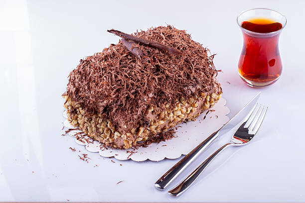 istock Whole Round Cake and Slice on Wood Table 469869452