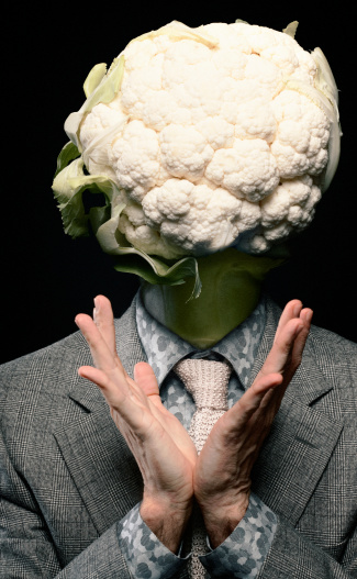 What a cabbage head! For this composite, a man, a cauliflower and a broccoli were sacrificed. Self portrait. Some digital grain added.