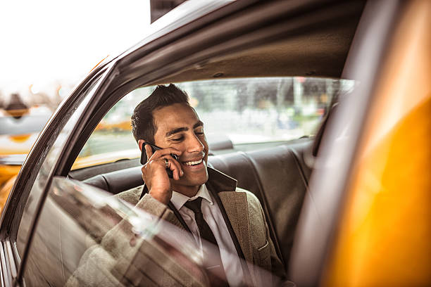 empresário em um amarelo cabina - india car people business imagens e fotografias de stock