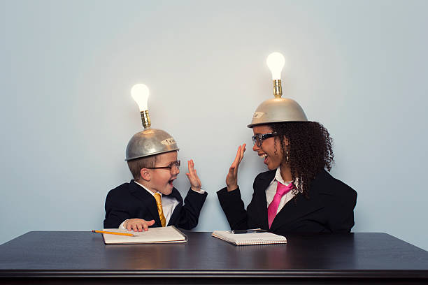 istock Business Team Celebrates wearing Mind Reading Helmets 469872133