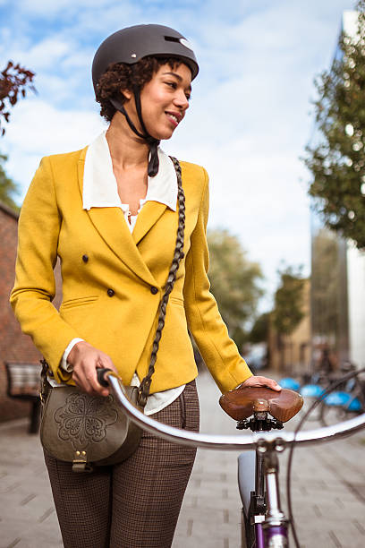 istock Casual biker walking on the street 469872275