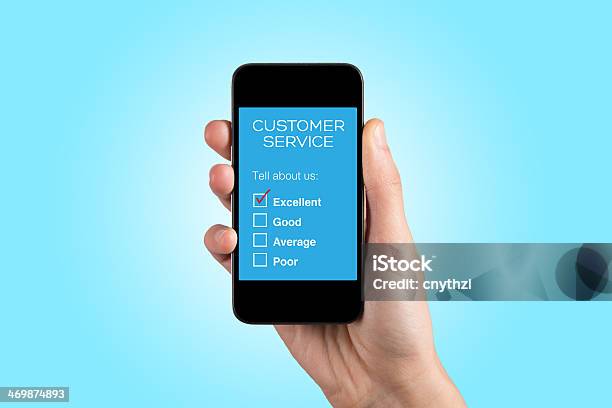 Hand Holding Smartphone With Customer Service Survey On A Screen Stock Photo - Download Image Now