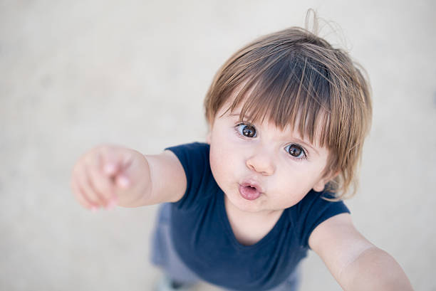 Young Baby Boy Asking to be Picked Up