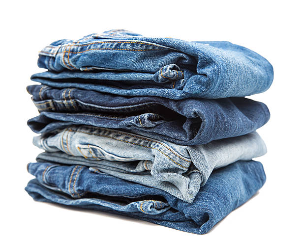 istock Stack of Denim Blue Jeans Isolated on White 469875468