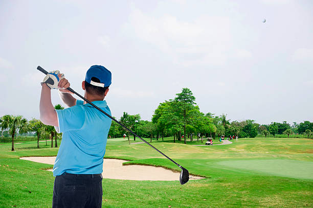 istock Golfer hits an fairway shot 469877871