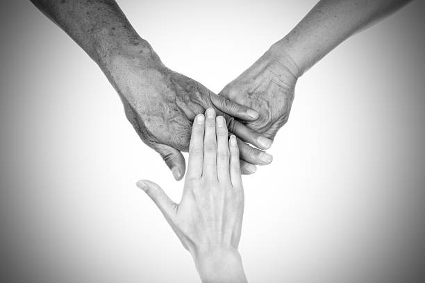 istock family love:senior parents and daughter hand 469881781