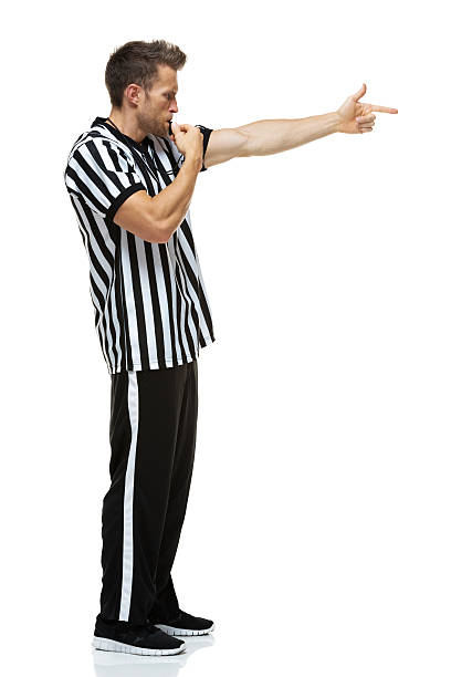 istock Side view of male referee pointing 469886273