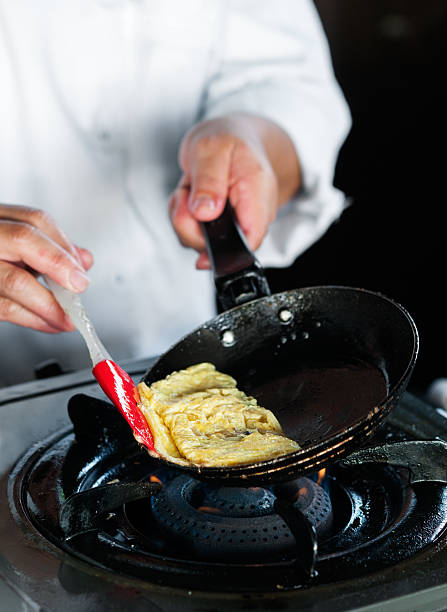 istock Cooking omelette in frying pan 469886597