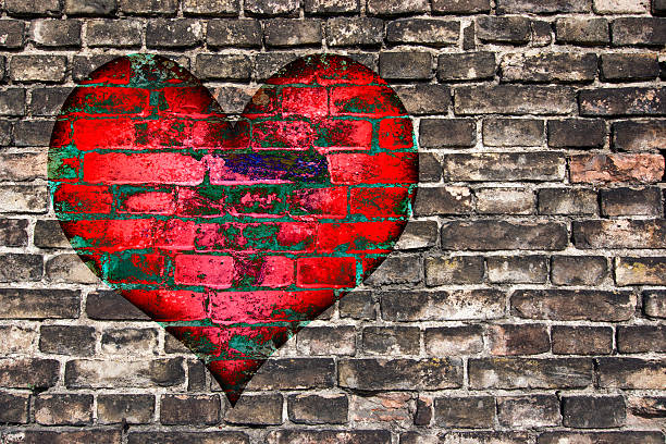 istock heart on the old wall 469890415