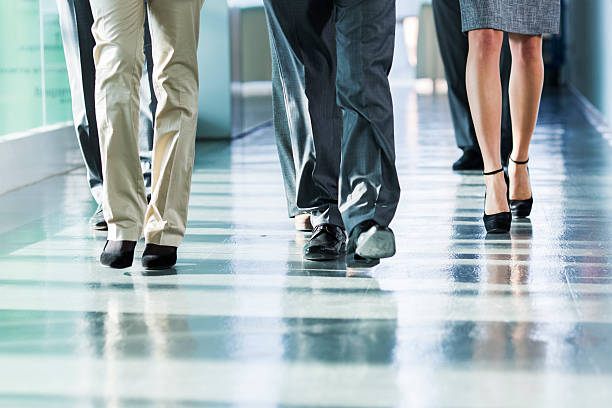 istock Group of business people walking on corridor 469891457
