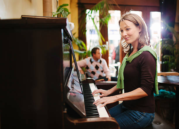 istock woman playing the piano 469892249