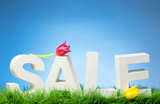Spring Sale - Word on Grass with Tulips and Blue sky
