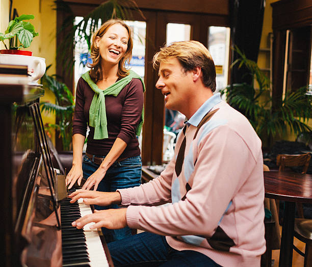 istock couple playing the piano 469892263