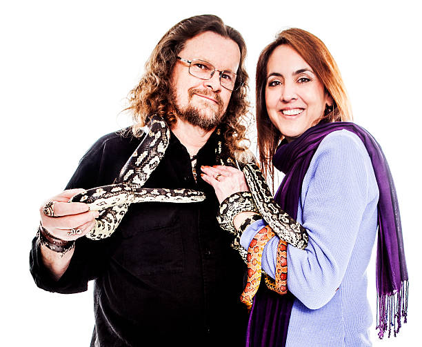 istock Couple Holding Snakes 469892431