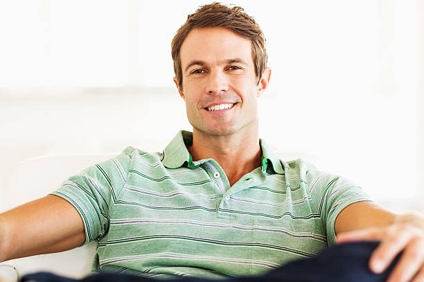 istock Confident Man Sitting On Chair At Home 469893565