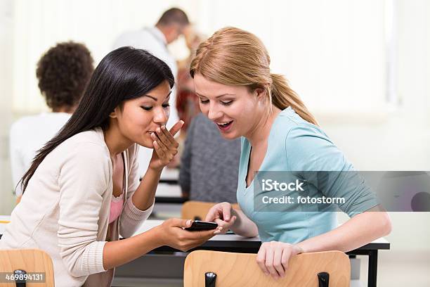 Students Gossiping During Class Stock Photo - Download Image Now - Adolescence, Adult, Cheerful